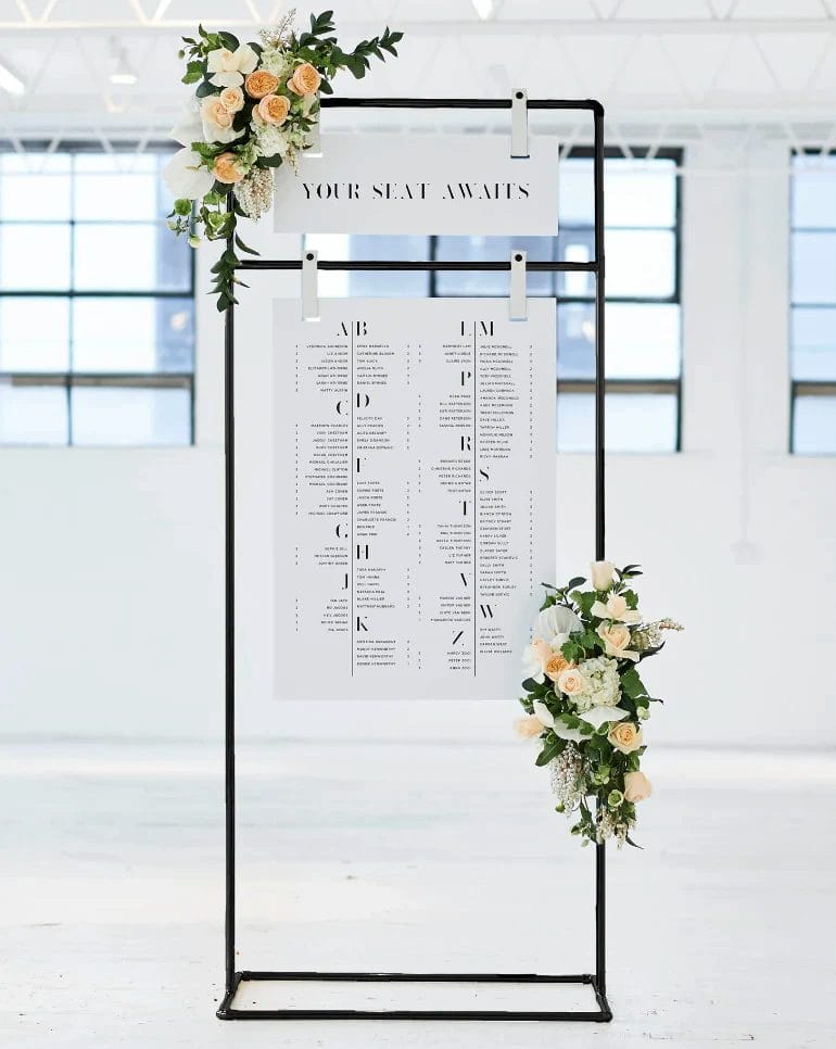 Suspend seating charts from frames or branches for a whimsical look.